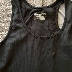 Under armour,. Women’s athletic tank top Size large, color black.